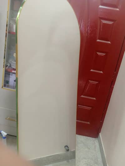 Full-length arched mirror