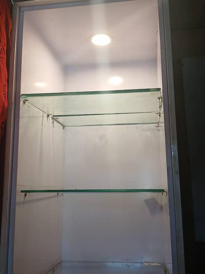 white solid multipurpose rack with glass slabs
