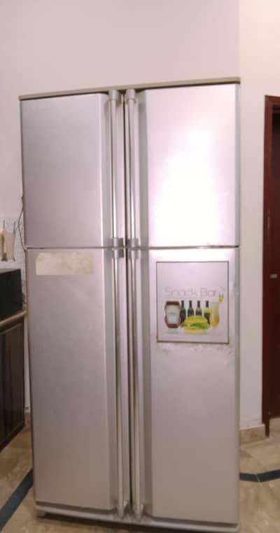4 door Dawlance fridge 9 years old without warrenty