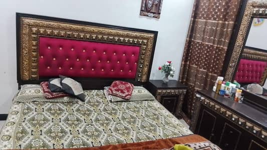 double bed with dressing table and side tables