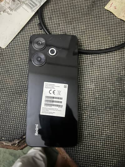 Redmi 13 128/8 GB Ram 4 months warranty left.