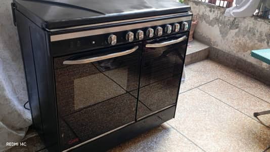 care cooking range with stainless steel deep fryer and metal top