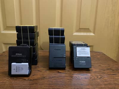 Nikon and canon dslrs batteries and chargers(100% original box pulled)