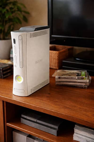 Xbox 360 available for sale in good working condition.