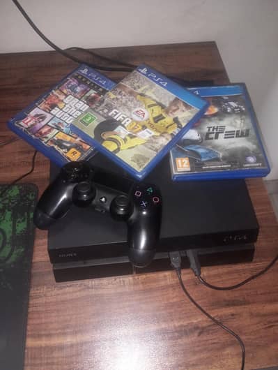 PS4 with three disc games and one original controller and a box