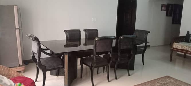 Top quality wood dinning table with glass top.