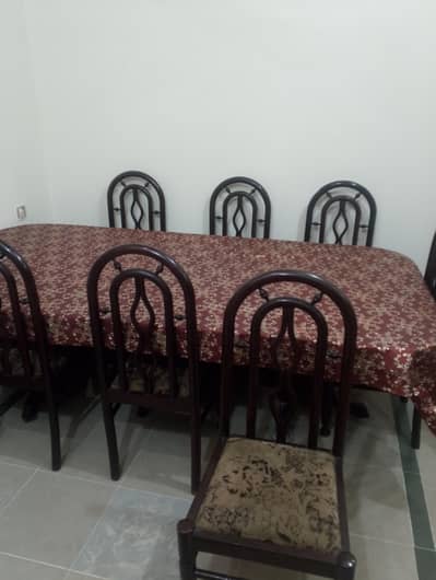 Dining Table With 8 chairs .   Heavy weight  table. used condition
