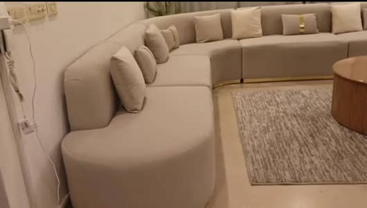 L Shaped Beige Sofa set + gray covers with rug and table