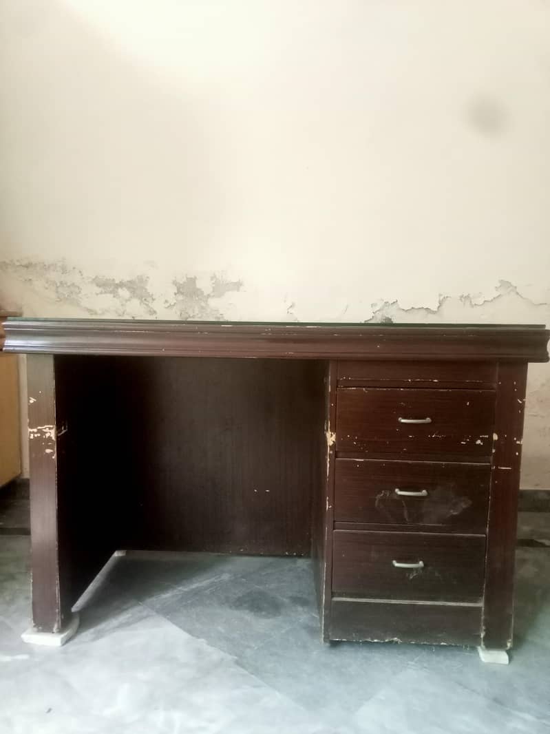 Solid office Table with clean glass on upper side. 0