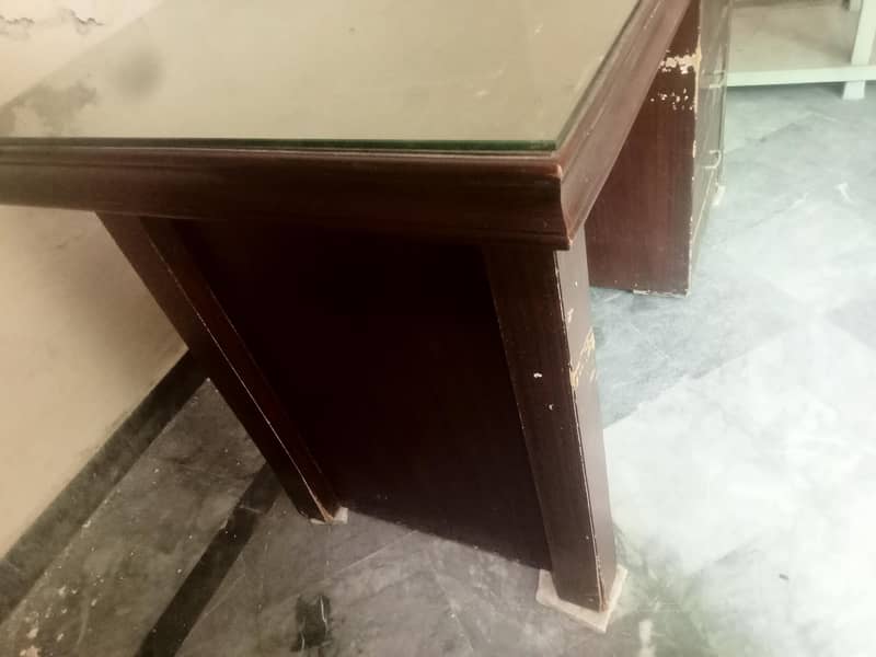 Solid office Table with clean glass on upper side. 3
