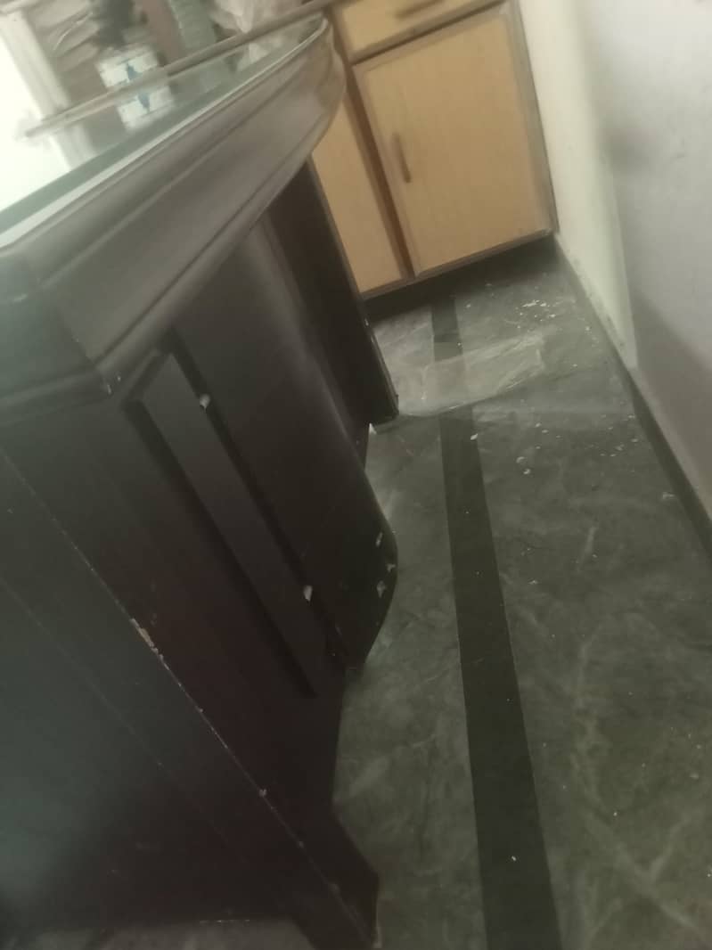 Solid office Table with clean glass on upper side. 4