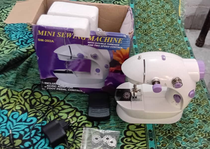 Mini Sewing Machine 0
