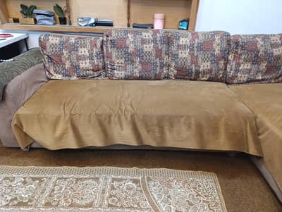 L-shaped beidge colored sofa