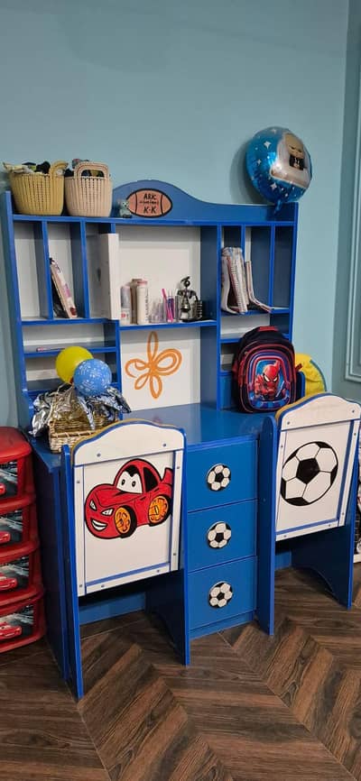kids study table with two chairs.
