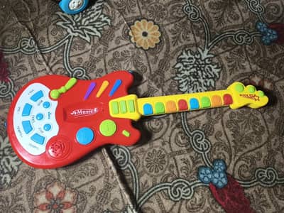 Dimple Electric Rockstar Kids’ Toy Guitar with Lights & Sound