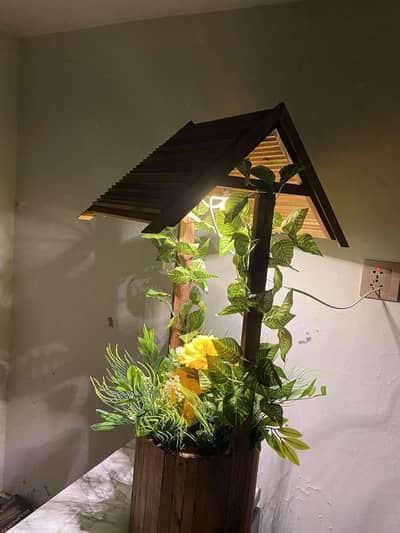 wooden hut shape flower lamp.
