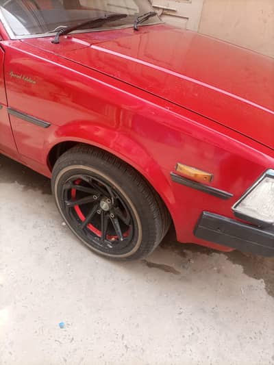 toyota corolla 1982 . fully painted red colour cng nd petol new poshis