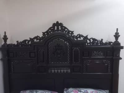 A beautiful bed made with solid wood purachased from Heaven' Furniture