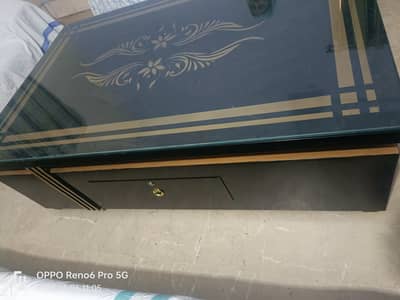 Table with 12mm glass on top (size 5.5 feet long and 3.5 feet wide)