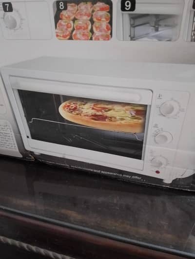 new and UN touch oven in hand