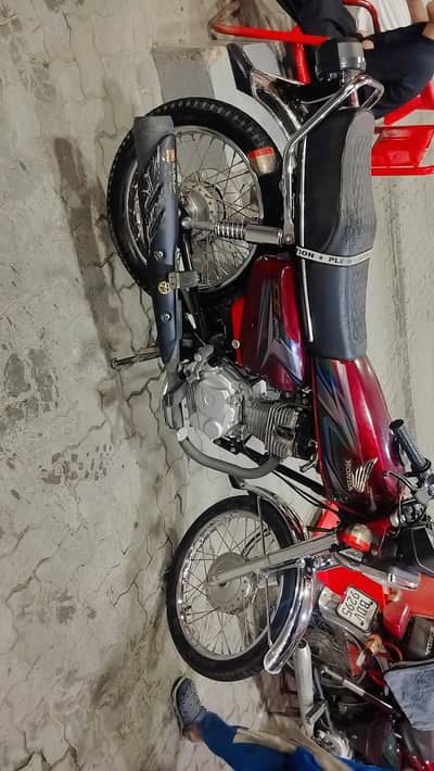 Honda 125 with golden number