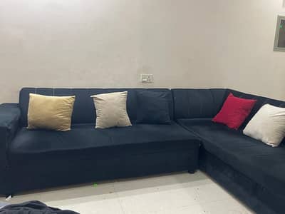 black 7seater Shaped sofa set with multicolor cushions