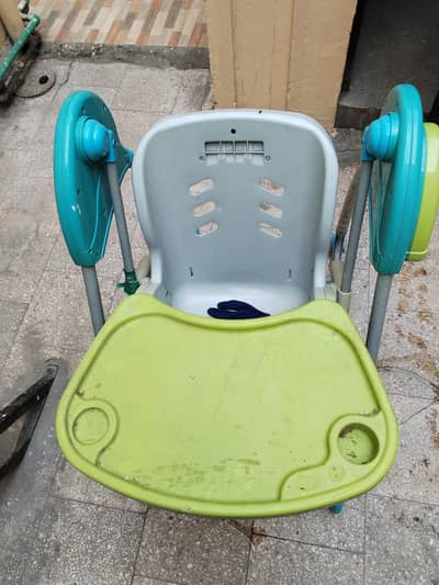 Selling a convertible high chair Swing. for children