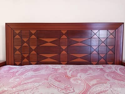 King size bed with side table