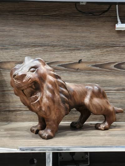 Majestic Hand-Carved Wooden Lion Sculpture