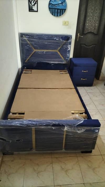 kid beds, 1 blue with side table, 1 red with side table