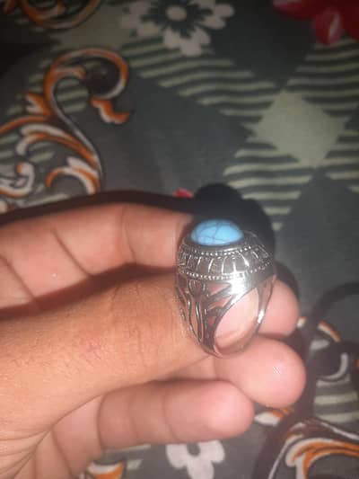 a beautiful ring with blue stone
