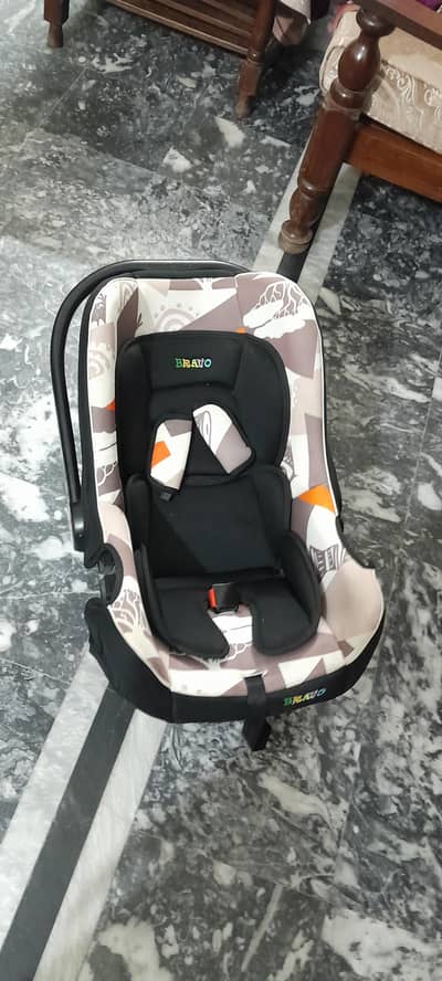baby cot and car seat