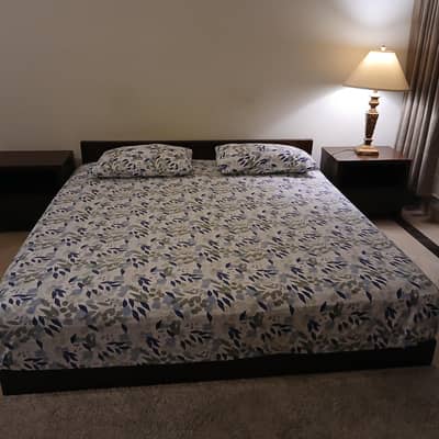 king size bed with two side tables