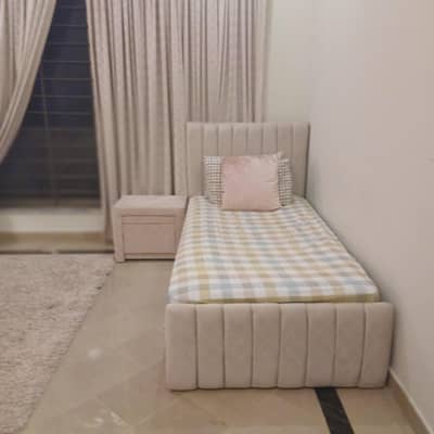 single bed with 1 side table