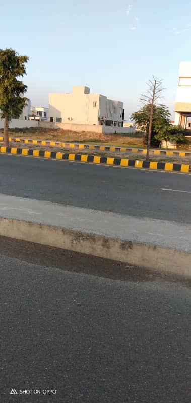 Rare Opportunity in DHA Phase 7 4 Kanal Three-Side Open Plot for Sale 70' Road