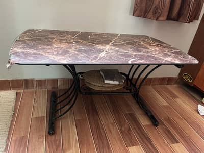 Centre table with iron rod stand and glass top