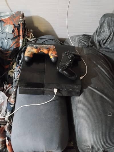 ps4 for sale with 2 control and games . fully working
