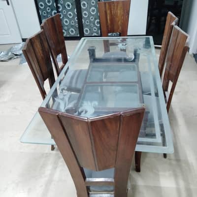 interwood Dining table with 6 chairs, glasss top very good condition