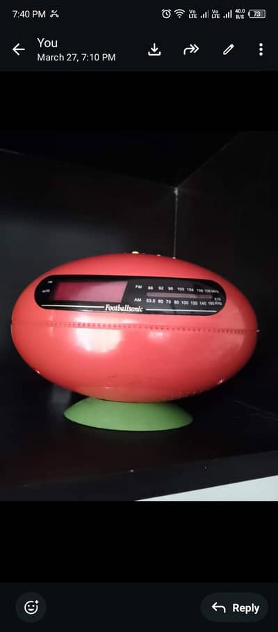 Football shape AM/FM radio with clock