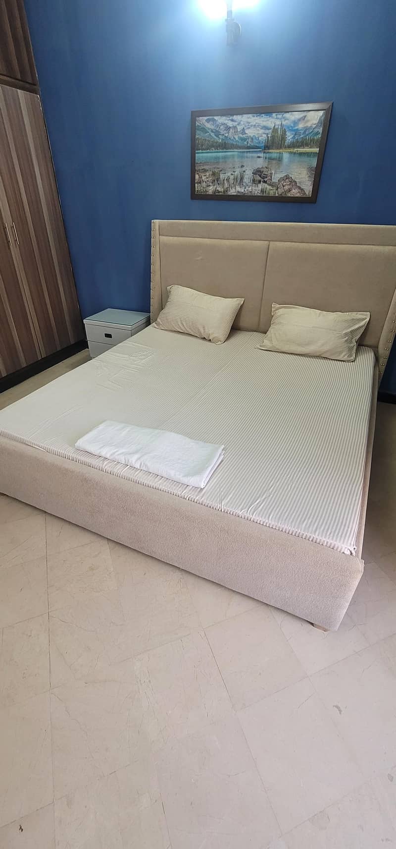 bed and sidetables . 2