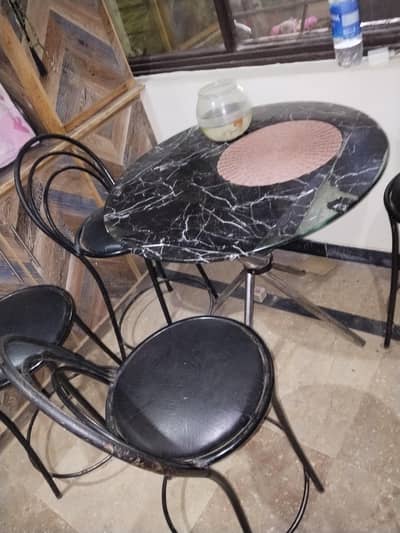 iron chair 4 and one round dining table with glass