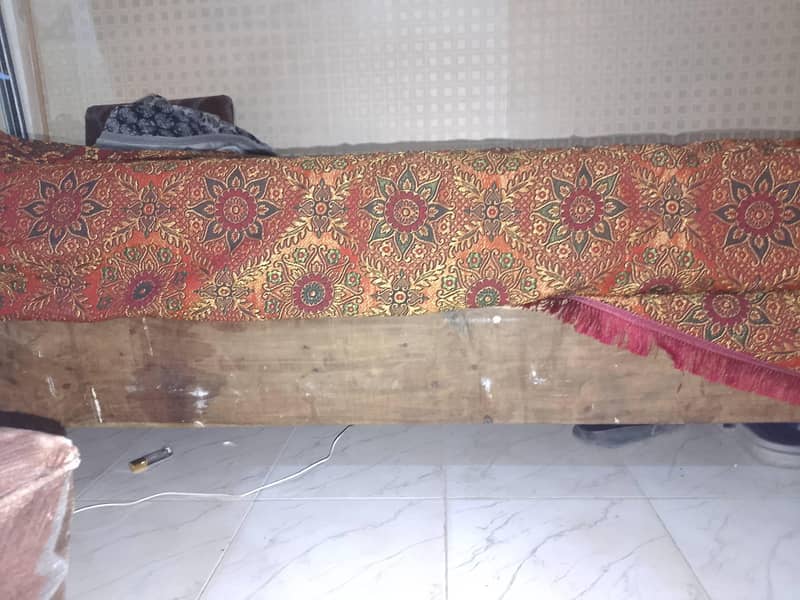 A bed , A Matress  , 2 Sofay , 1 Table . 1