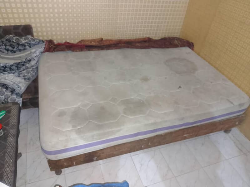 A bed , A Matress  , 2 Sofay , 1 Table . 2