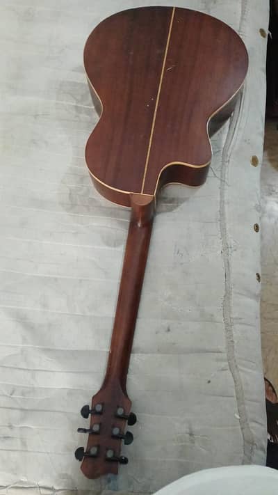 6-string acoustic guitar with a cutaway body.