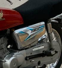 125 Self start side covers