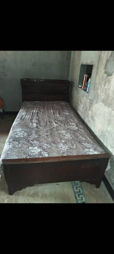 wooden single bed
