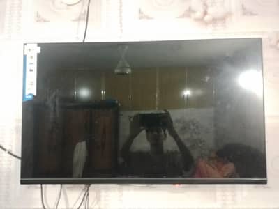 smart TV with box and stand