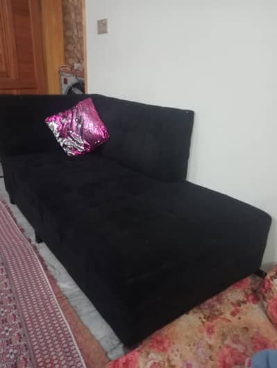 Elegant black velvet sofa.