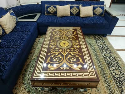 Blue L-shaped sofa and table