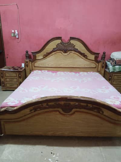 queen bed with side tables and dressing table